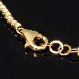 Längenverstellbares Armband, mit vielen kleinen Goldkügelchen bestückt, aus 585 14K Gelbgold in ca. 17,5 - 20 cm Länge