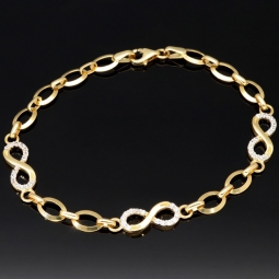 Glänzendes Goldarmband mit Infinity-Elementen mit weißen Zirkoniasteinen in 585 14K Gold in (ca. 18,5 cm Länge, ca. 6 mm Breite)