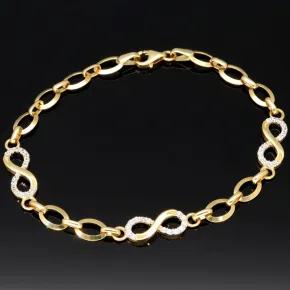 Glänzendes Goldarmband mit Infinity-Elementen mit weißen Zirkoniasteinen in 585 14K Gold in (ca. 18,5 cm Länge, ca. 6 mm Breite)