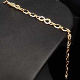 Glänzendes Goldarmband mit Infinity-Elementen mit weißen Zirkoniasteinen in 585 14K Gold in (ca. 18,5 cm Länge, ca. 6 mm Breite)