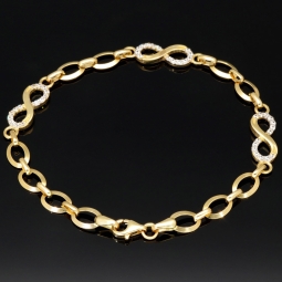 Glänzendes Goldarmband mit Infinity-Elementen mit weißen Zirkoniasteinen in 585 14K Gold in (ca. 18,5 cm Länge, ca. 6 mm Breite)