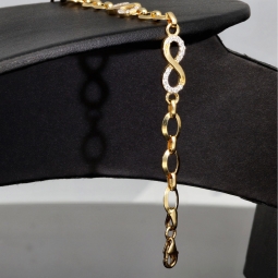 Glänzendes Goldarmband mit Infinity-Elementen mit weißen Zirkoniasteinen in 585 14K Gold in (ca. 18,5 cm Länge, ca. 6 mm Breite)