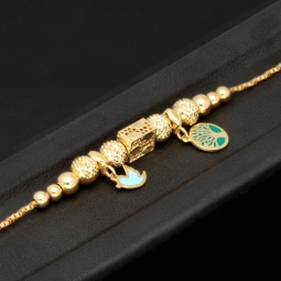 Außergewöhnliches Goldarmband mit detailreichen, eingearbeiteten Elementen und Goldperlen (585er 14k), ca. 19cm lang