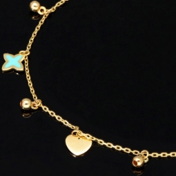 Trendiges Goldarmband mit glänzenden, eingearbeiteten Anhängern und Goldperlen (585er 14k), ca. 19cm lang