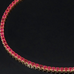 Hochwertiges produziertes 585 / 14K Gold Tennisarmband mit strahlenden pink-lila Zirkoniasteinen (ca. 18,5 cm)