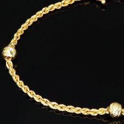 Glänzendes Twist-Armband / Kordelarmband mit stilvoll eingearbeiteten Goldperlen aus hochwertigem 585 14k Gold, ca. 2mm breit, 18,5cm lang