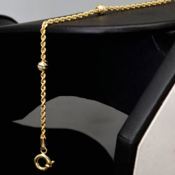 Glänzendes Twist-Armband / Kordelarmband mit stilvoll eingearbeiteten Goldperlen aus hochwertigem 585 14k Gold, ca. 2mm breit, 18,5cm lang