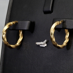 Glänzende Greco-Creolen in zeitlosem Twist-Design aus funkelndem 585er / 14K Gold