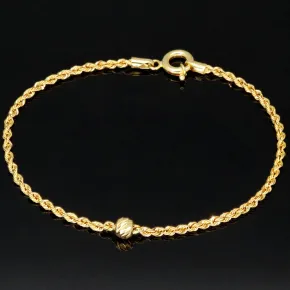 Hochwertig produziertes Twist-Armband / Kordelarmband mit stilvoll eingearbeiteter Goldperle aus edlem 585 14k Gold, ca. 2mm breit, 19cm lang