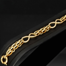 Exklusives Goldarmband mit eingearbeiteten Unendlichkeits-Elementen präzise besetzt mit weißen Zirkoniasteinen in 585 14K Gold in (ca. 20 cm Länge, ca. 9 mm Breite)
