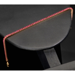 Fein gearbeitetes Tennisarmband aus edlem 585 / 14K Gold mit funkelnden pink-lila Zirkoniasteinen besetzt (ca. 17,5 cm)