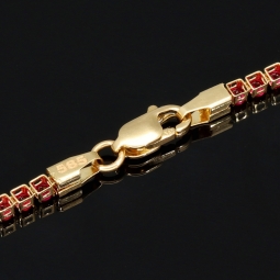 Fein gearbeitetes Tennisarmband aus edlem 585 / 14K Gold mit funkelnden pink-lila Zirkoniasteinen besetzt (ca. 17,5 cm)