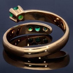 Außergewöhnlicher Solitär -Schlangen Ring bestückt mit insgesamt 4 runden dunkel grasgrünen Smaragden in 18K / 750 Gelbgold, hergestellt in Handarbeit